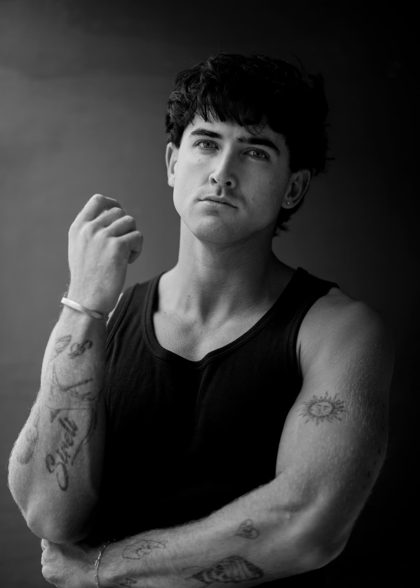 Black and white portrait of a man in a tank top