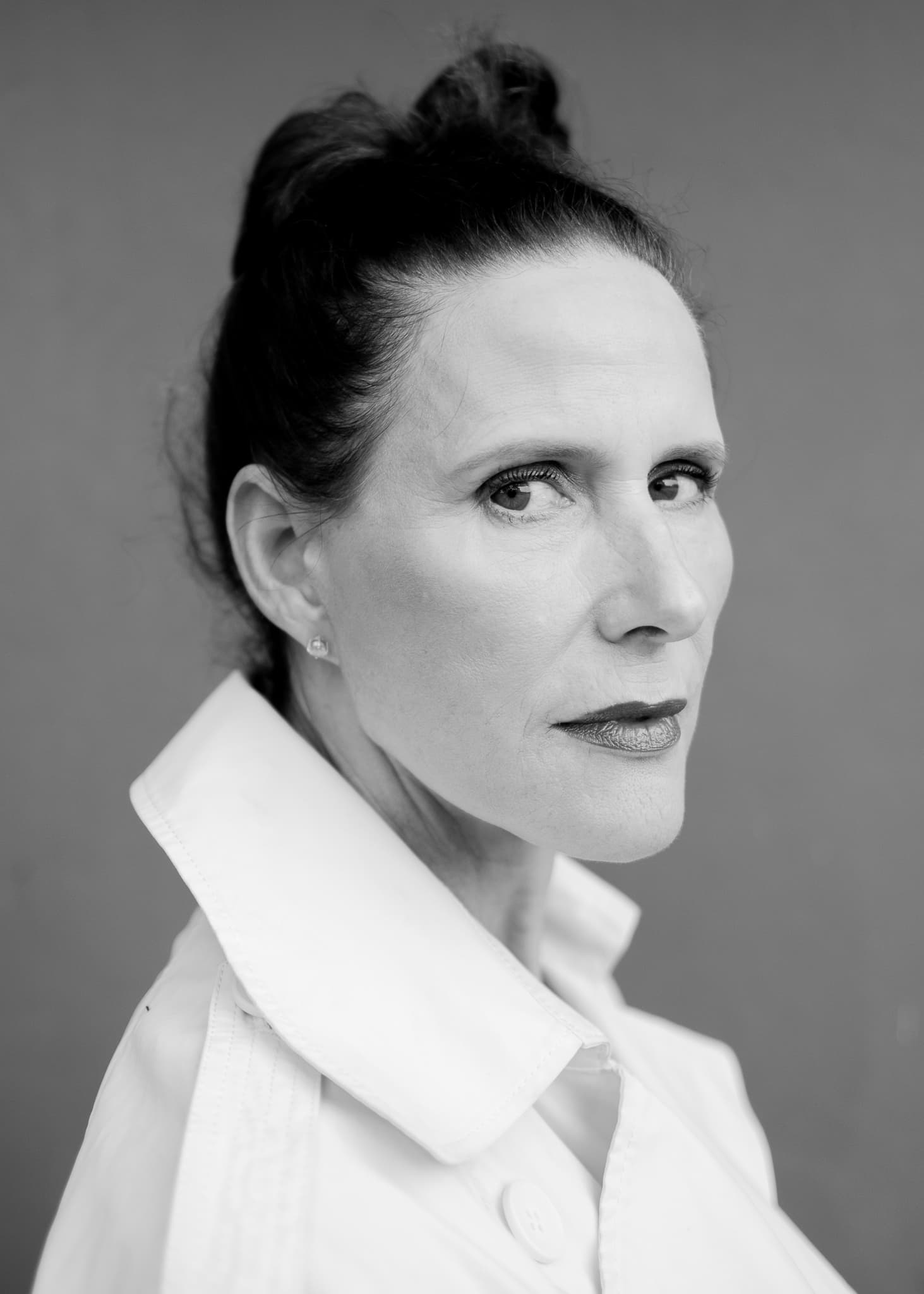 Black and white portrait of an older woman in profile, white collar